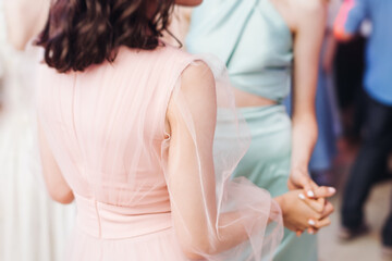 High school graduates dancing on prom, waltz and classical ball slow dance in dresses and suits on...