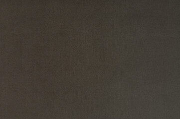 Dark textured surface with subtle color variations makes intriguing backdrop