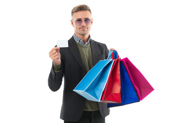 Purchasing present. Buy pay online with card. Man pay with card in shop mall. Big discount at shopping sale. Man holding shopping bag isolated white. Man with shopper bag in mall. Sales consultant.