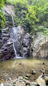 Tropical cloud forest with beautiful waterfall close to Playa Brava in Tayrona National Park, Colombia.