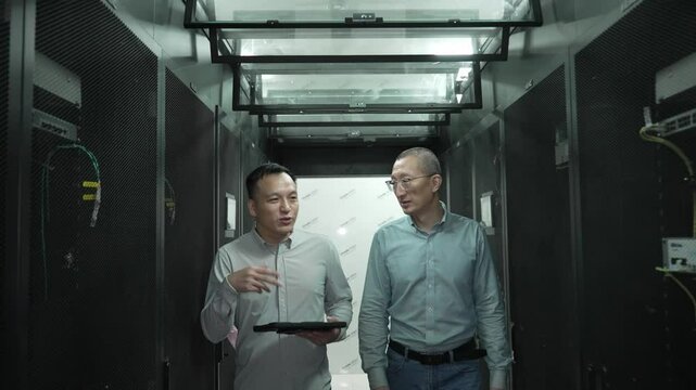 asian engineer working in datacenter