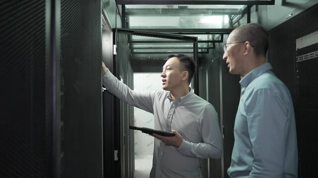 asian engineer working in datacenter