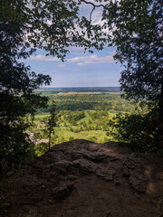 A view from the top of the Niagara Escarpment looking down at a golf course. At Kelso Park along the Bruce Trail in Milton, Ontario during the summer