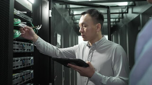 asian engineer working in datacenter