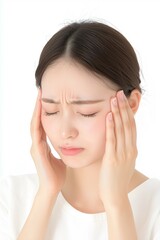 Young Woman Touching Her Temples with a Tense Expression