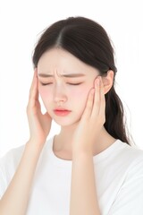 Young Woman Touching Her Temples with a Tense Expression