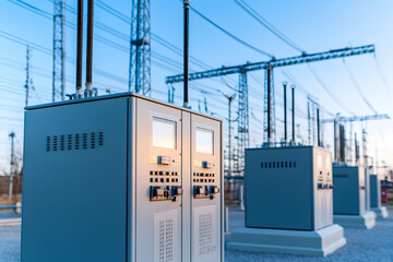 Electrical power station infrastructure. Utility station with grid and power lines. Outdoor electric facility in the evening light, energy grid.