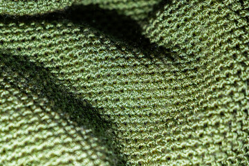 Green mesh textured fabric under the light
