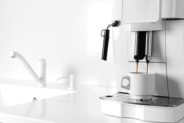 White coffee machine making espresso. Americano dropping in white cup. Preparation process