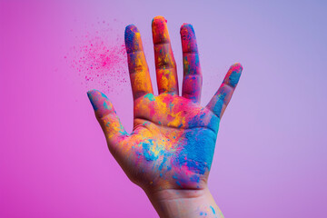 Close-up of a single hand splattered with vivid Holi powder isolated on a gradient background