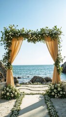 Fototapeta premium Beautiful wedding arch decorated with flowers on the beach by the sea