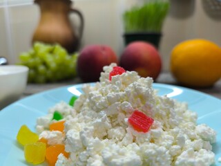 Homemade rustic crumbly cottage cheese on a plate. Still-life. High quality photo