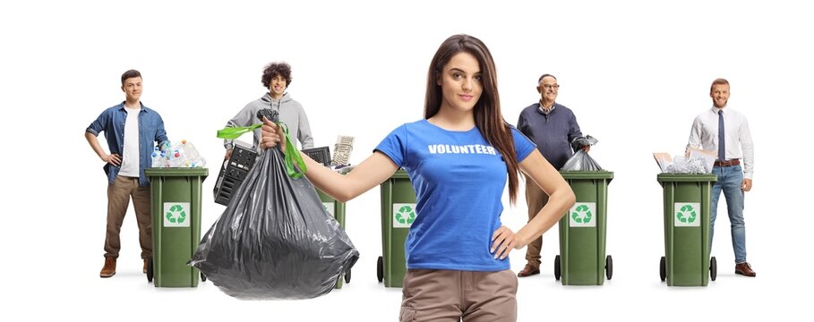 Female volunteer holding a plastic waste bag and men recycling different materials