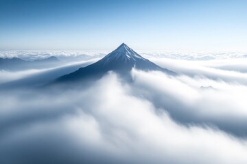 Majestic Mountain Peak Above the Clouds: A Serene Aerial View