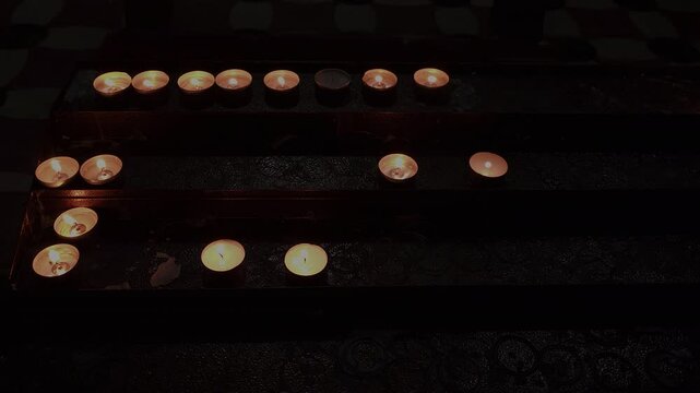 Prayer candles burn in Messina Cathedral