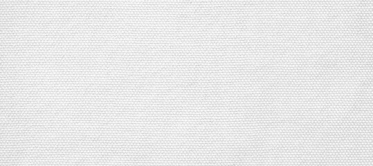 Textured white fabric background with subtle details.