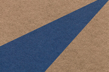 Texture of old craft navy blue and brown color paper background, macro. Structure of vintage abstract umber cardboard