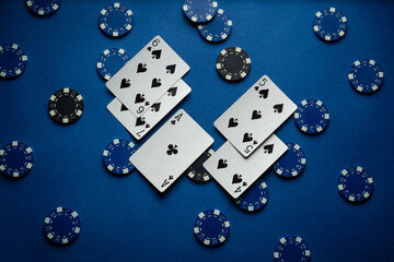 Blue table in the poker club with a combination of winning playing cards high card and chips....