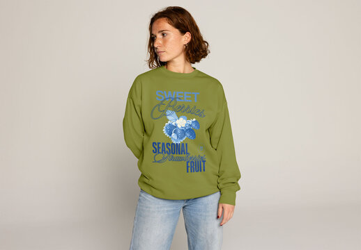 Young Woman With Red Hair Wears a Cozy Sweater in a Studio. PSD mockup ready to insert your design and change the color