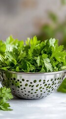 Fototapeta premium Fresh parsley in colander, kitchen counter, cooking prep (1)