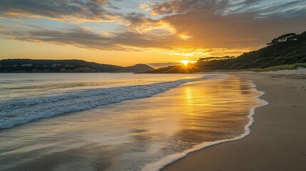 Obraz premium A stunning sunset over a beach, featuring vibrant colors and gentle waves lapping at the shore, creating a serene coastal atmosphere.