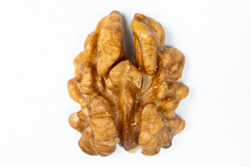 Macro peeled walnut, kernel, white isolate background, top view.