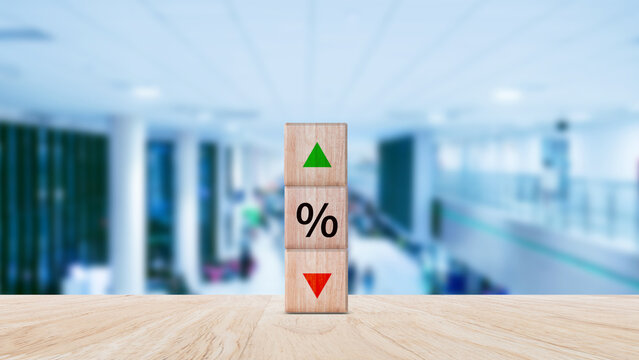 Financial, stocks, interest rate and GDP percent change, wooden block with percentage sign and arrow up sign and down for interest rate, ranking