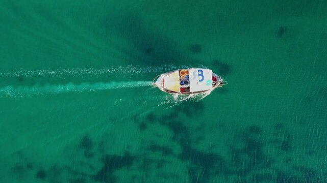 Aerial view of a fishing boat sailing in Nea Potidea canal. Greece, Kassandra, Halkidiki