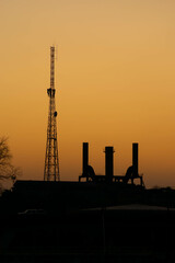oil refinery at sunset