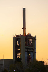 oil refinery at sunset
