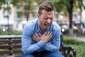 Obraz premium A photo of a man experiencing a panic attack in a public space