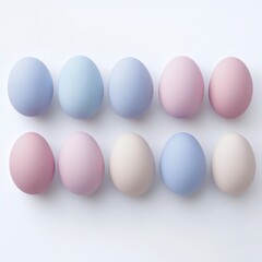Colorful pastel eggs arranged in two rows on a white surface for festive decoration and celebration during spring season