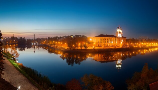 panorama of the night city with the rays of lanterns and a beautiful reflection in the water ternopil ukraine