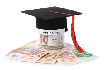 Graduate hat, euro banknotes and glass jar with word Education isolated on white. Tuition payment