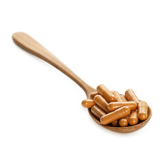 Turmeric capsules in spoon isolated on white
