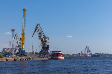Fototapeta premium Seaport of Vyborg, cargo terminal coastal view with cranes