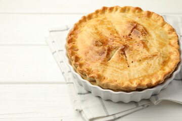 Delicious fresh homemade pie on white wooden table, closeup. Space for text