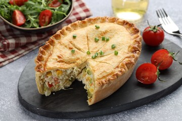 Delicious fresh homemade pie served on gray textured table, closeup