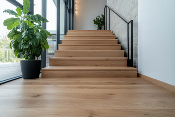 Fototapeta premium Modern staircase with wooden steps and greenery in a well-lit interior space