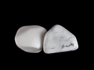 Howlite is a snow-white mineral with gray veins, symbolizing calmness and tranquility.