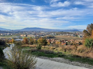 Concrete path leading to a residential area overlooking the city of skopje in autumn