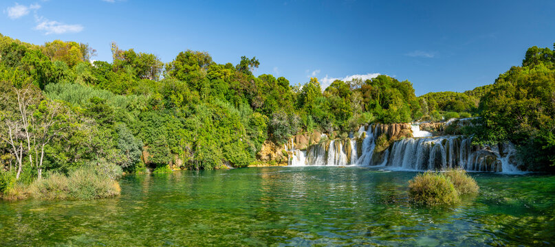 Croatia, Dalmatia, Krka National Park - 20 August 2024 - Overview with a fantastic waterfall in the Krka national park surrounded by greenery