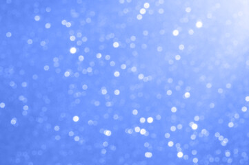 Blurred blue bokeh light background with a serene and abstract mood