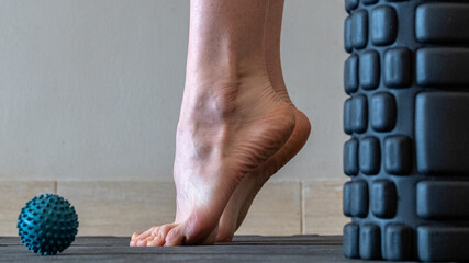 Blue spiky rubber massage ball for recovery massage. MFR ball for rehabilitation and health. Sports...