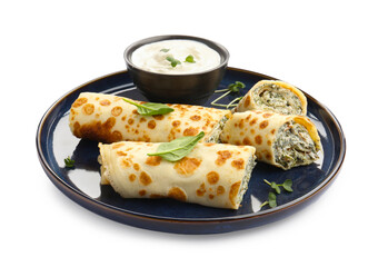 Delicious crepes with cottage cheese, spinach and sour cream isolated on white