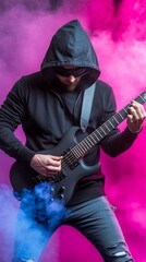 Obraz premium Musician playing guitar in smoky studio