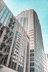 A tall building with a lot of windows and a fire escape