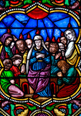 Stained glass (19th century) of Pentecost Sunday: The Holy Spirit Comes and descending on disciples...