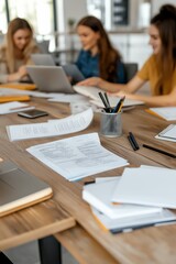 Fototapeta premium Female Study Group Gathered in Dorm Common Room with Laptops and Documents Exchanging Ideas Helping Each Other with Coursework