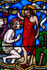 Fototapeta premium Stained glass (19th century) of Baptism of Jesus by John the Baptist in the Jordan river..